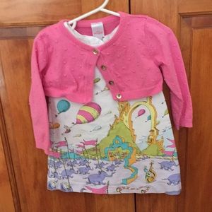 Dr. Seuss sleeveless dress with pink sweater.